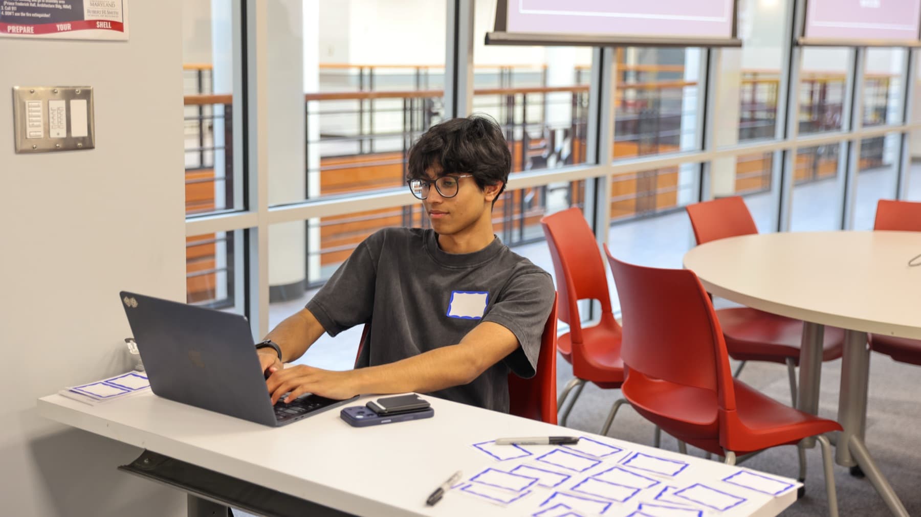 A DVCG analyst working at a laptop in the Dingman Center